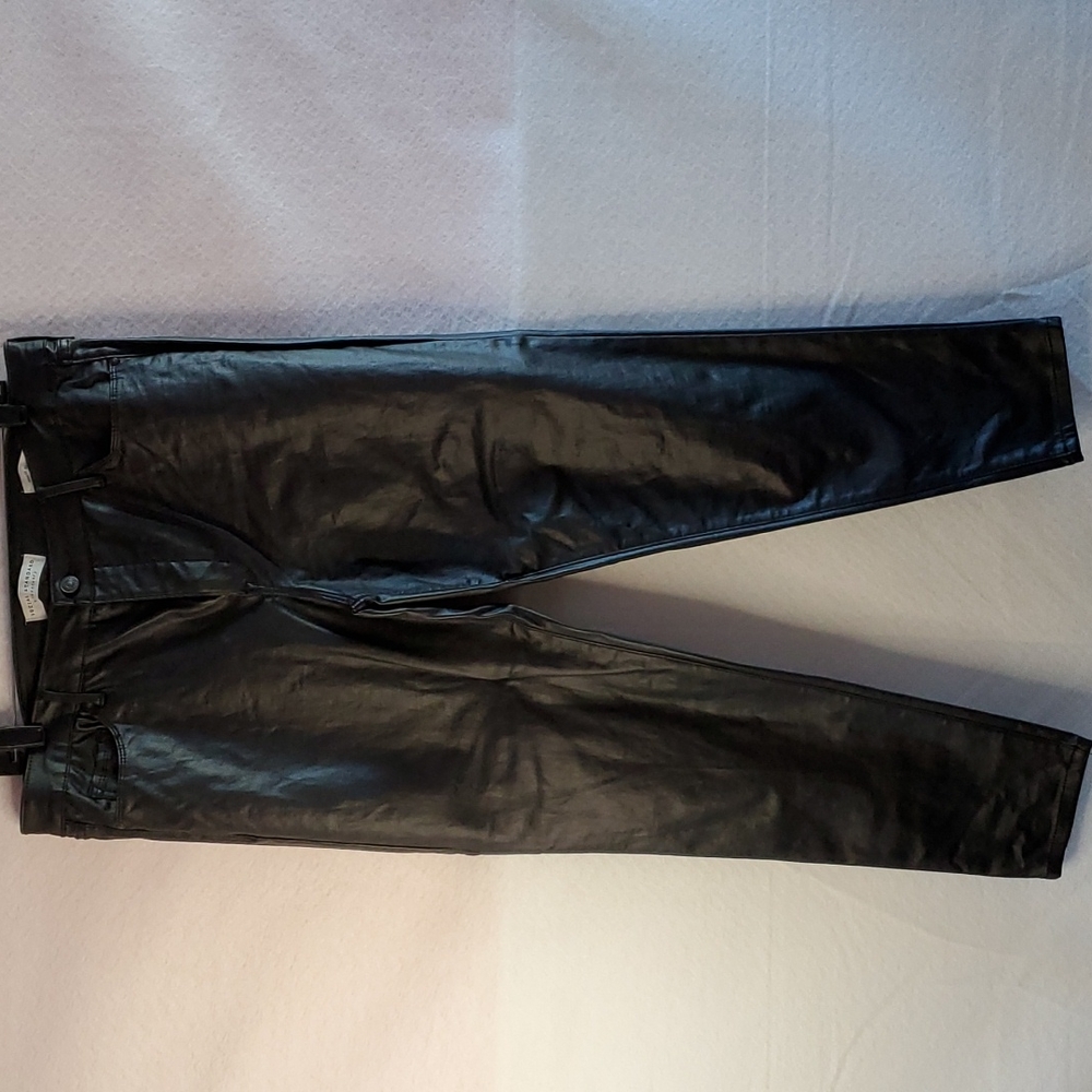 Women black faux leather ankle skinny jeans.